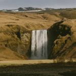 Skógafoss waterfall in South Iceland under morning light near Harmony Seljalandsfoss
