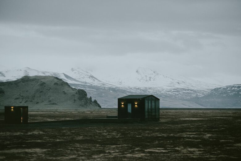 Glass roof lodge at Harmony Seljalandsfoss alone on the South Iceland tundra beneath snow covered mountains