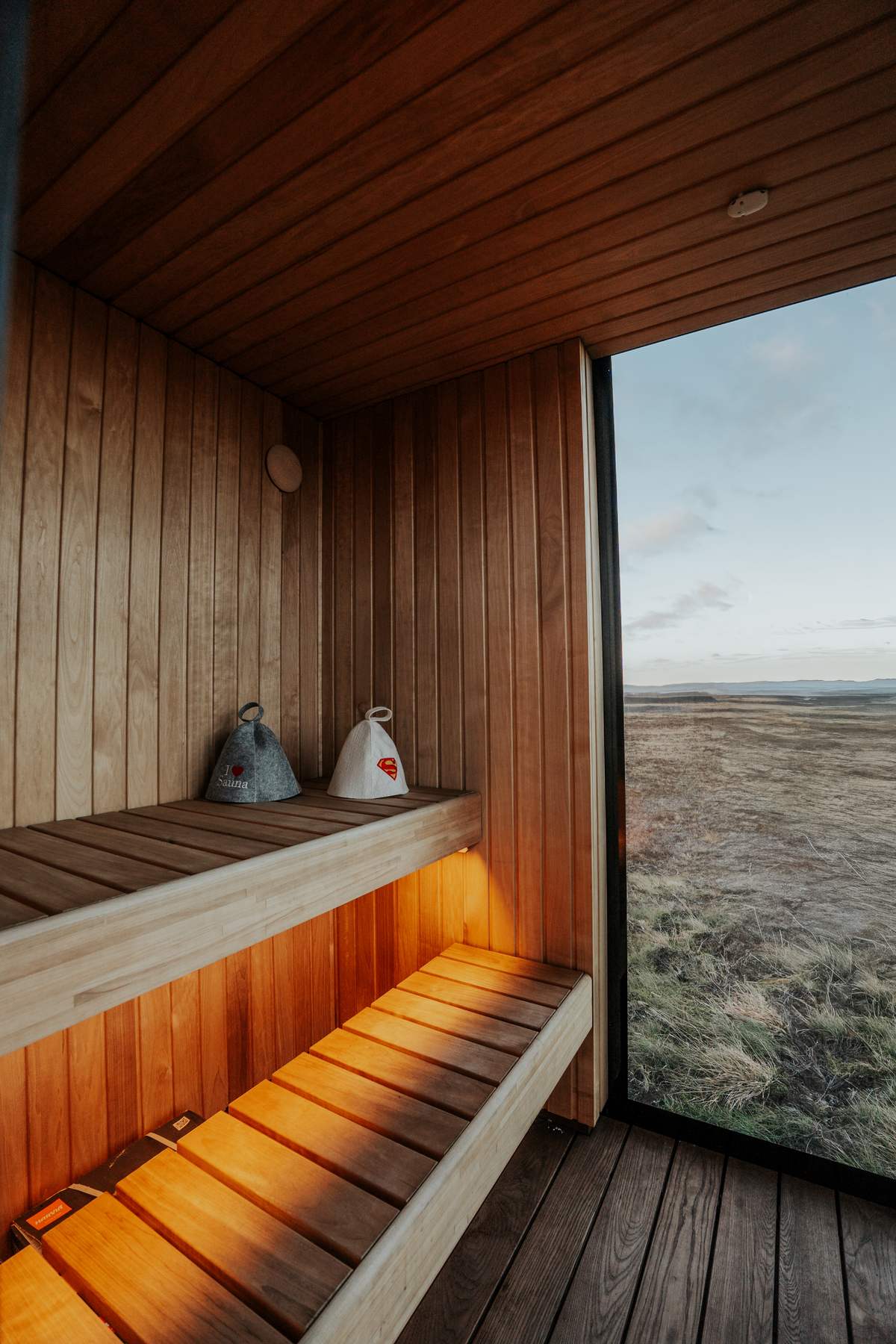 Private sauna with a panoramic window over the autumn tundra at Harmony Seljalandsfoss