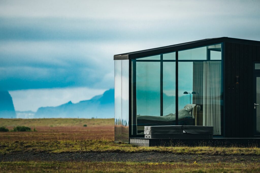 Glass lodge at Harmony Seljalandsfoss with the Westman Islands on the horizon, Iceland
