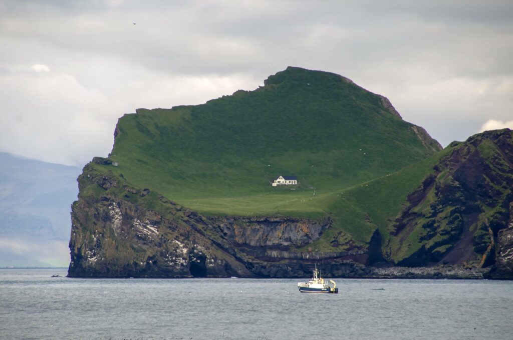 The lonely white house on Elliðaey island, Westman Islands, Iceland